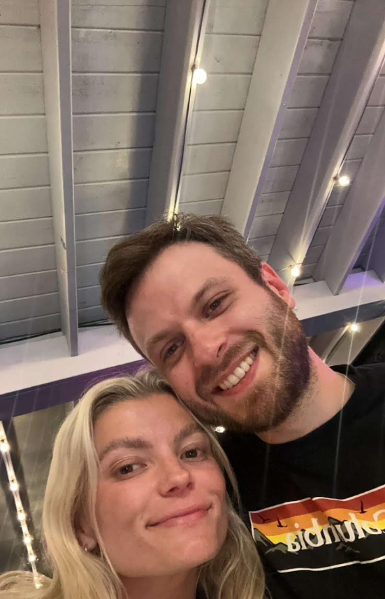 Allison and Jacob smiling together on a night out