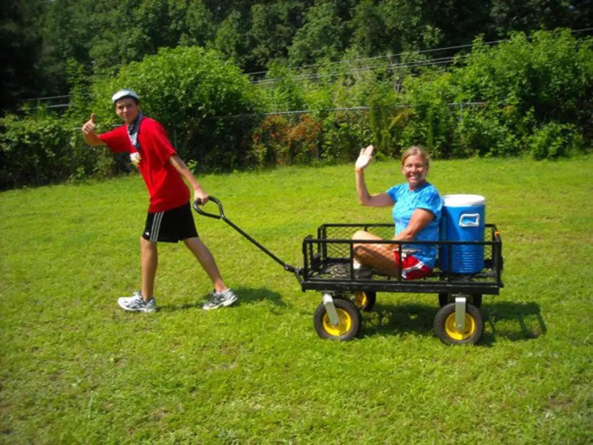 Jacob pulling a wagon at cub scout day camp, June 2010