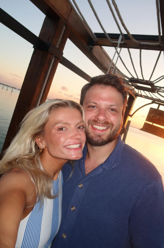Allison and Jacob at sunset on the water in Cancun